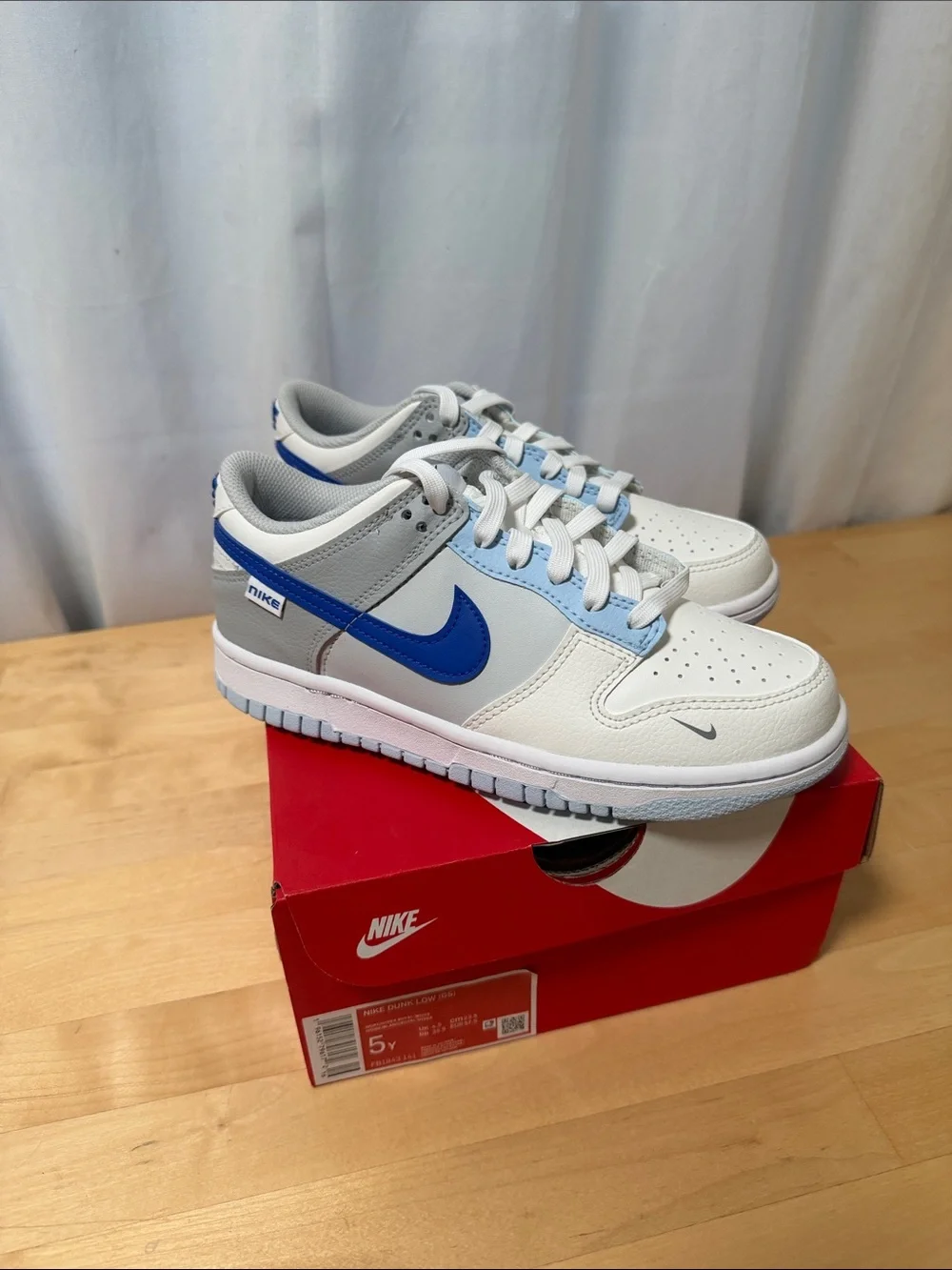 Nike Kids Low Top Sneakers in White and Blue Accent